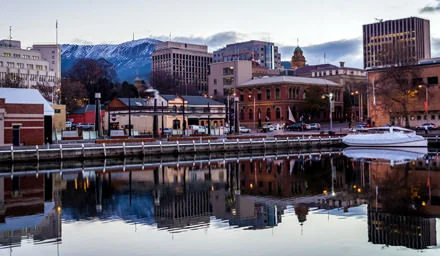 Waterfront in wintertime in Hobart, with Mt. Wellington covered in snow.